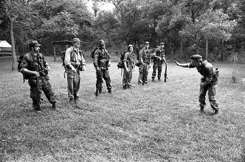 Survival school students form a military-style lineup, Liberal, 1982