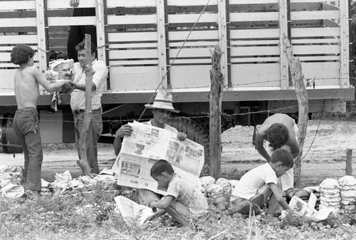 Wrapping clay pieces, La Chamba, Colombia, 1975