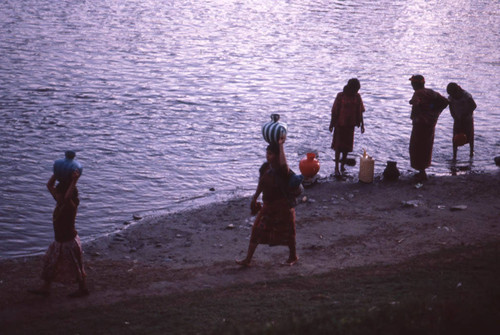 Guatemalan refugees collect water at the river, Puerto Rico, ca. 1983