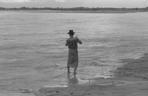 Fisherman holding a net, La Chamba, Colombia, 1975