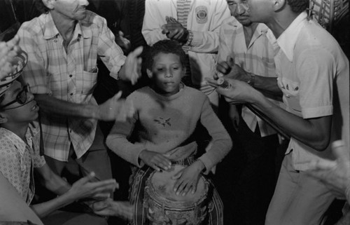 Boy playing the conga drum, Barranquilla, Colombia, 1977