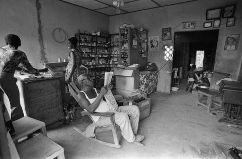 Fermín Herrera reads the newspaper, San Basilio de Palenque, Colombia, 1977