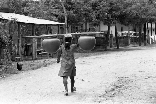 Transporting clay goods, La Chamba, Colombia, 1975