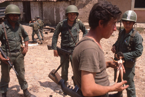 Patrol standing in the street, San Antonio de los Ranchos, Chalatenango, El Salvador, 1981