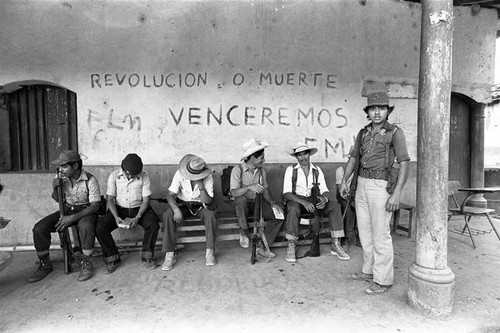 Guerrilleros sitting, Corinto, Morazán, 1983