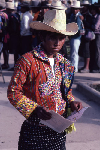 Mayan man holding his ballot on election day, Nahualá, 1982