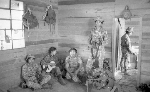 Young soldiers inside a house, Guatemala, 1982