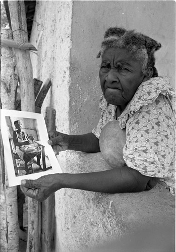 Woman holding a portrait, San Basilio de Palenque, 1977