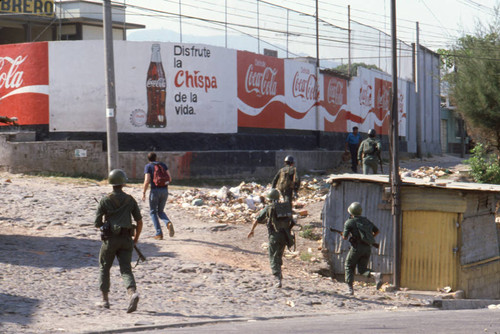 Soldiers patrolling on election day, San Salvador, El Salvador, 1982