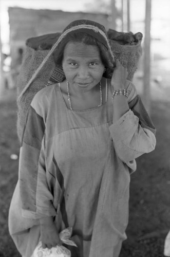 Woman carries bag on her head, La Guajira, Colombia, 1976