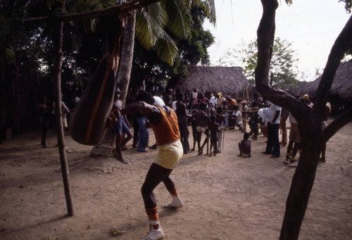 Boxer working out on a punching bag, San Basilio de Palenque, 1976