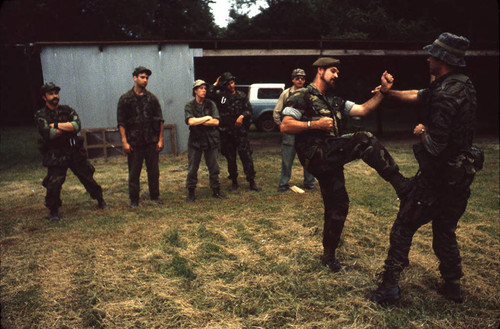 Camp instructor demonstrates combat techniques, Liberal, 1982