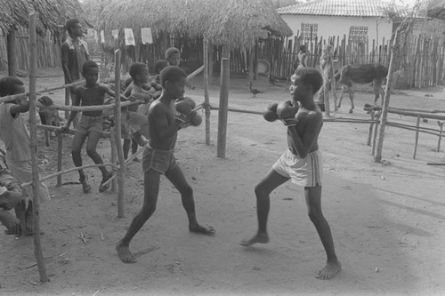 Boxers fighting inside ring, San Basilio de Palenque, ca. 1978