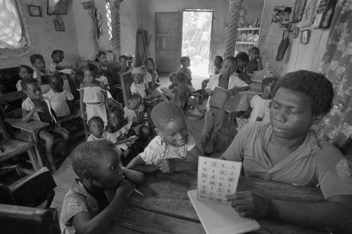 Teacher working with students in informal classroom, San Basilio de Palenque, ca. 1978