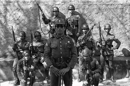 National guardsmen pose with rifles, Suchitoto, Cuscatlán, El Salvador, 1981