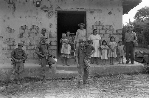 Civilians and army soldiers in front of building, Perquín, 1983