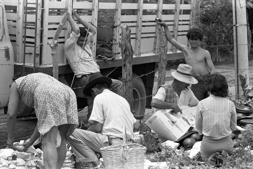 Wrapping clay pieces, La Chamba, Colombia, 1975