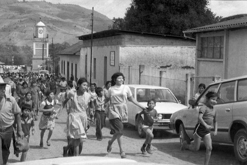 Mayan children run in a neighborhood, Guatemela City, 1982