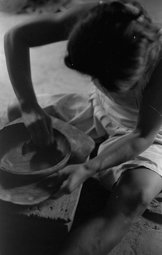 A woman making pottery, La Chamba, Colombia, 1975