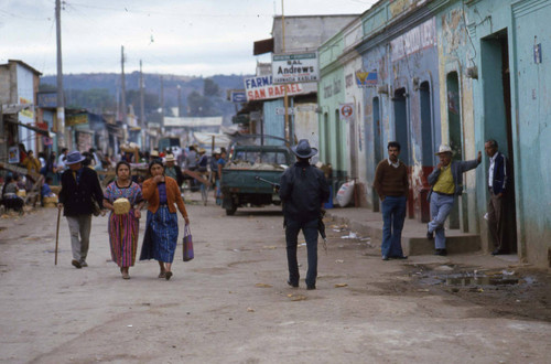 Mayan women walk through a busy Chimaltenango street, Chimaltenango, 1982