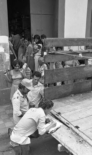 People line up outside of a building, Nicaragua, 1979