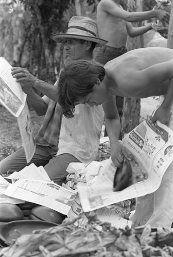 Wrapping clay pieces, La Chamba, Colombia, 1975