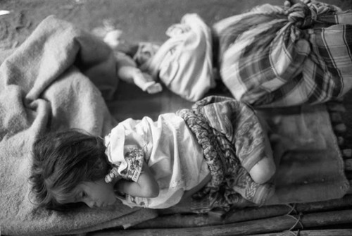 Refugee girl on a makshift cot, Chiapas, 1983