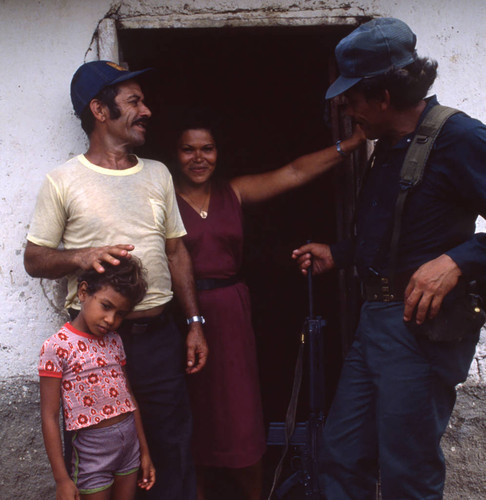 Contra soldier with people, Honduras, 1983