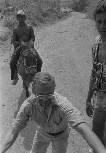 Man gets on the back of a truck, San Basilio del Palenque, ca. 1978