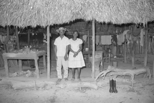 Couple standing under a porch, San Basilio de Palenque, 1976