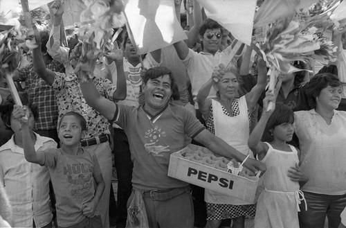 Crowd cheering at political rally, San Salvador, 1982