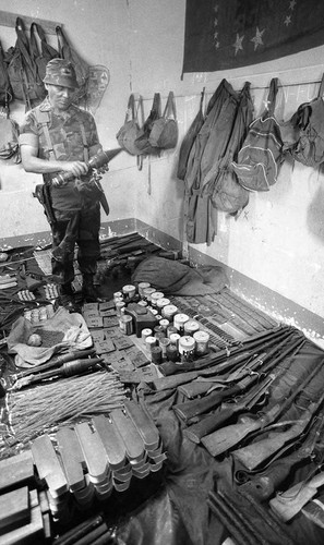 General Benedicto Lucas García presides over captured supplies, Guatemala, 1982