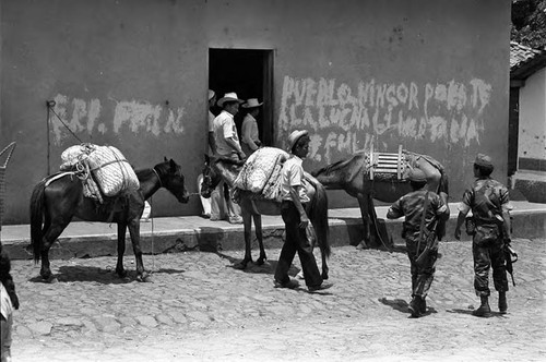 Soldiers and civilians in town, Morazán, 1983