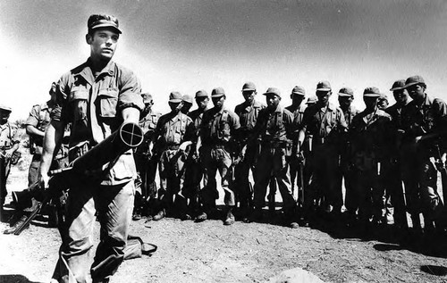 U.S. advisor demonstrates a mortar, Ilopango, San Salvador, 1983