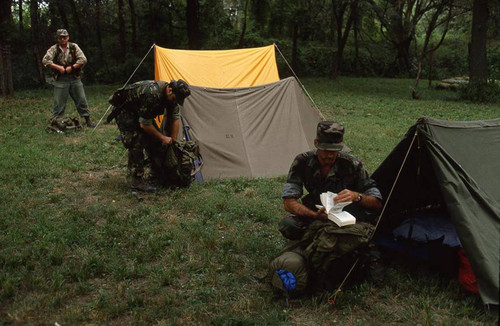 Survival school students near tents, Liberal, 1982