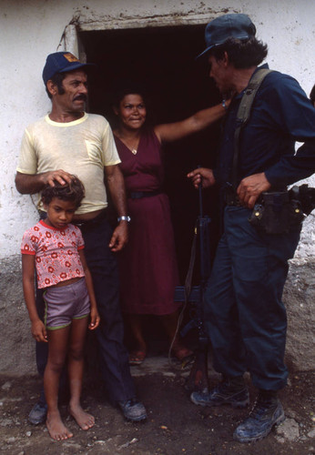 Contra soldier with people, Honduras, 1983