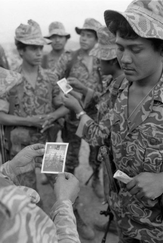 Army men hold photographs, Chajul, 1982