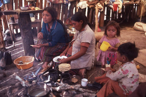 Guatemalan refugees cook tortillas, Puerto Rico, 1983