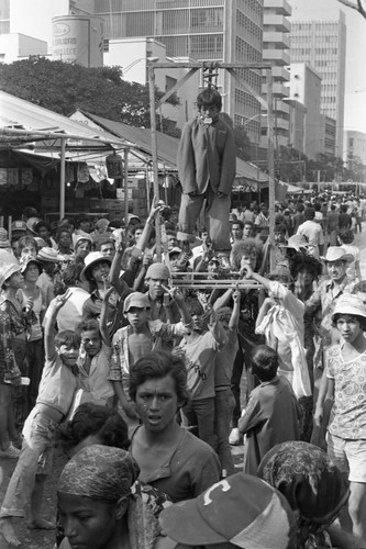 Young boy performing from a gallows, Barranquilla, Colombia, 1977