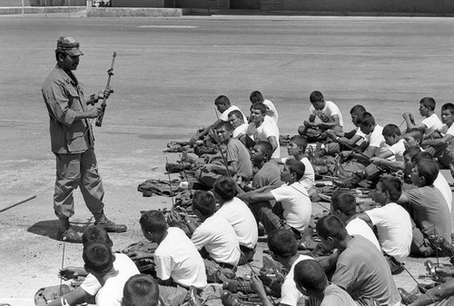 U.S. military advisor training Salvadoran soldiers, Ilopango, 1983