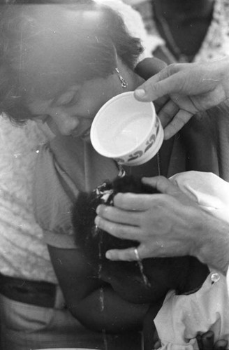 Child being baptized, San Basilio de Palenque, 1975