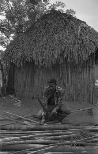 Man smoothing wood, San Basilio de Palenque, 1977