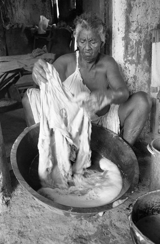 Woman washing clothes, San Basilio de Palenque, 1977