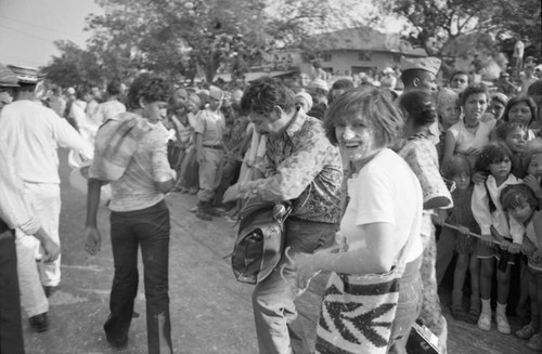 Nina S. de Friedemann with face powder walking in the street, Barranquilla, Colombia, 1977