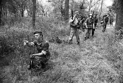 Survival school students participate in an obstacle course, Liberal, 1982