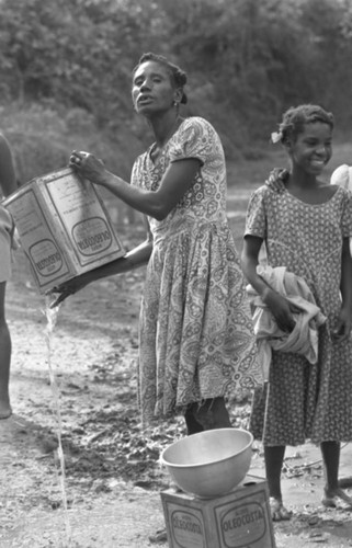 Woman collecting water, San Basilio de Palenque, Colombia, 1977