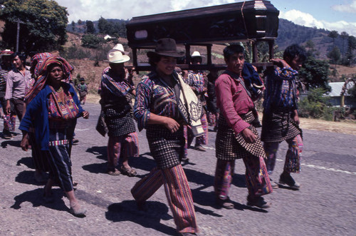 Mayan men carrying a coffin to a cemetery, Patzún, 1982