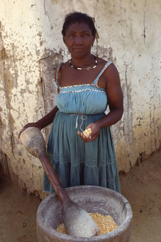 Woman holding corn in her hand, San Basilio de Palenque, 1976