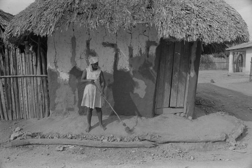 Woman sweeping the floor, San Basilio de Palenque, 1976