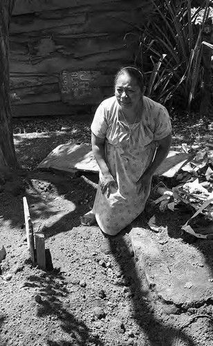 Woman mourns near a grave, Nicaragua, 1979